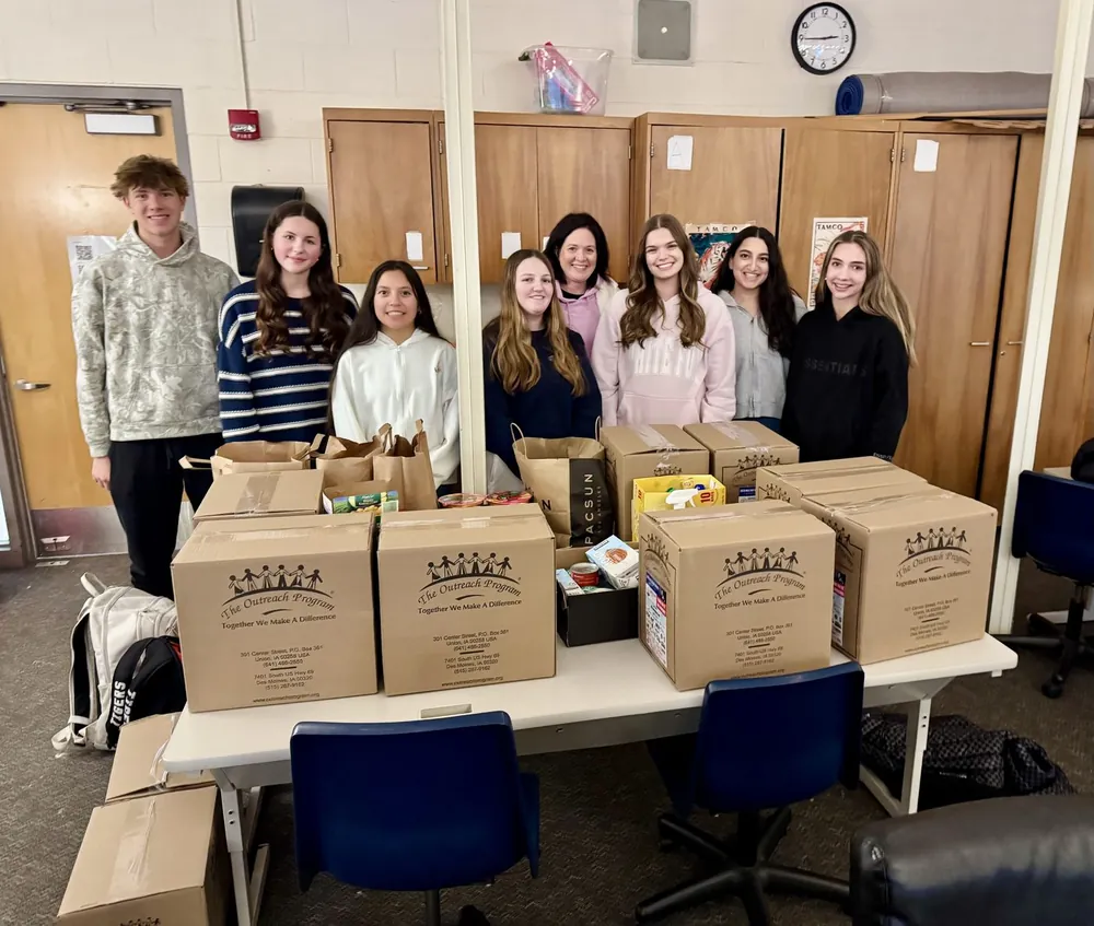 Volunteers with boxes of donations